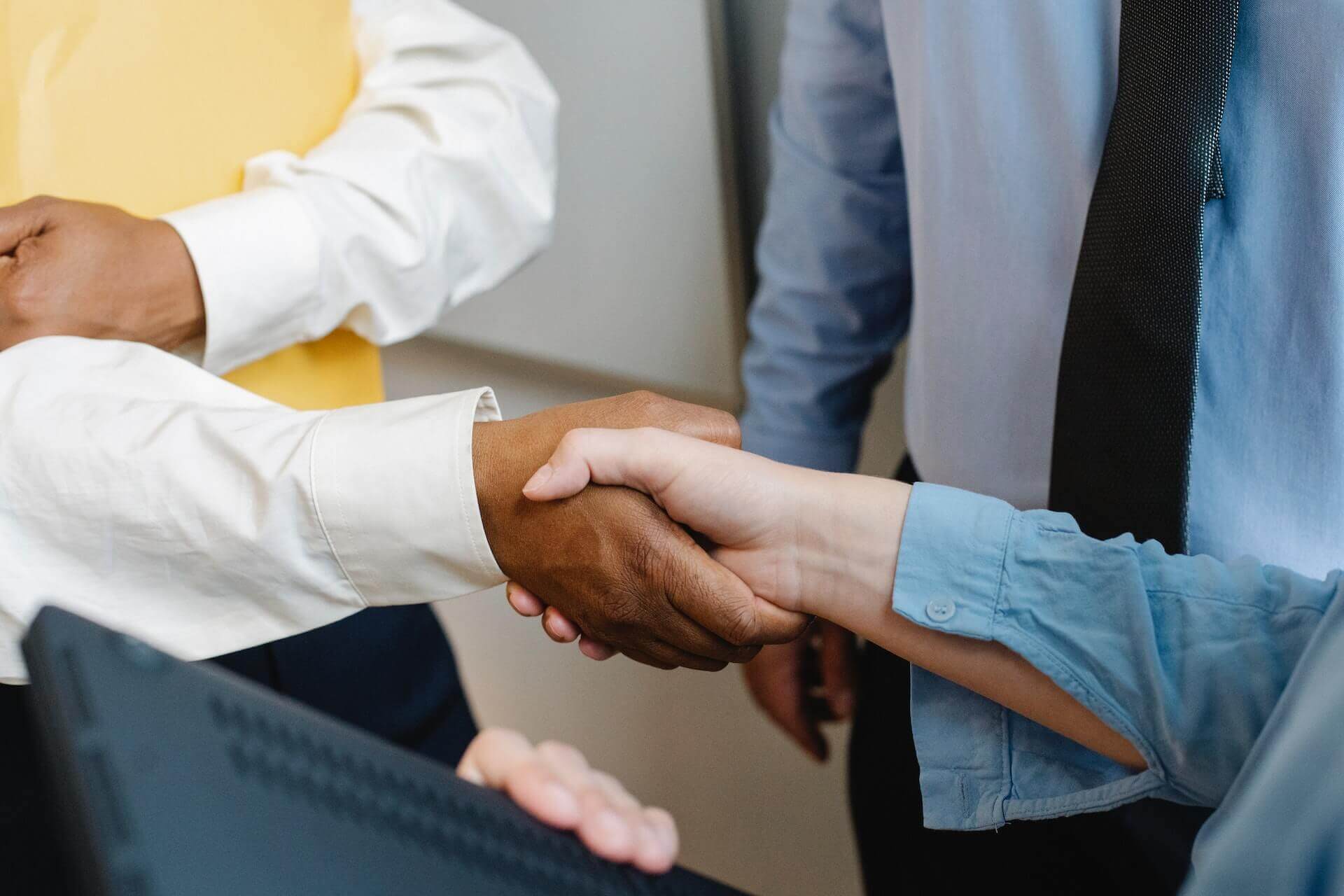 Two people shaking hands to seal a deal.