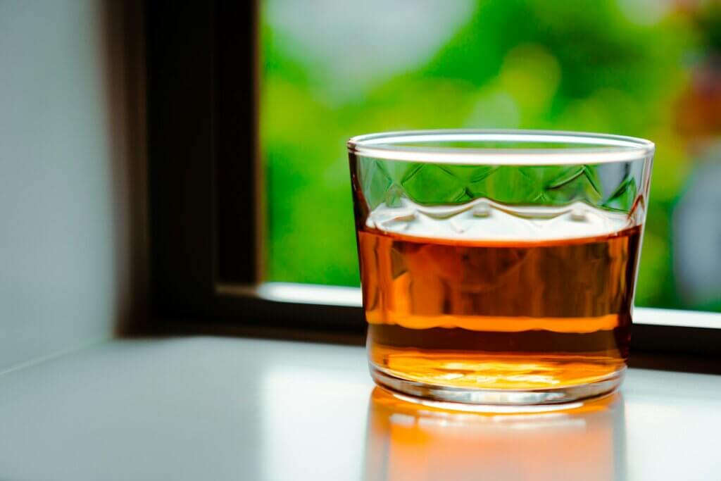 Whiskey in a glass by a window